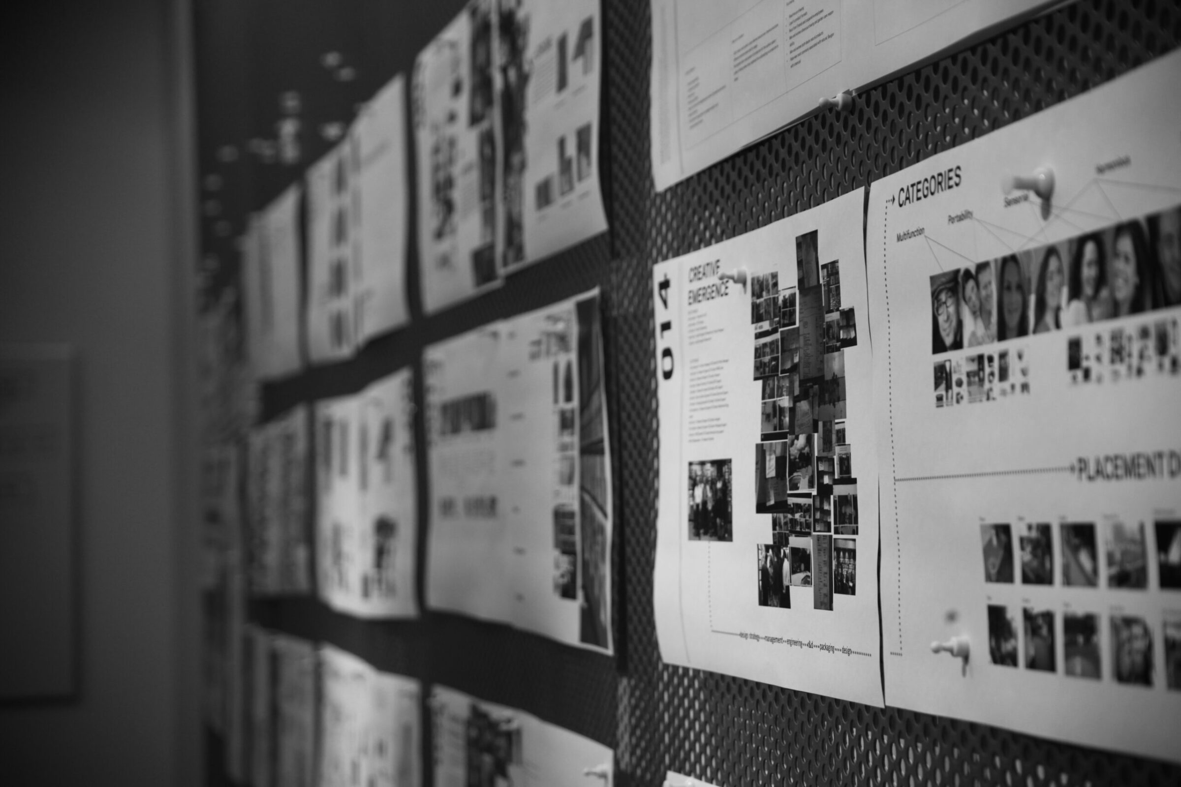 A wall of pinned research boards showing photo collages and category diagrams